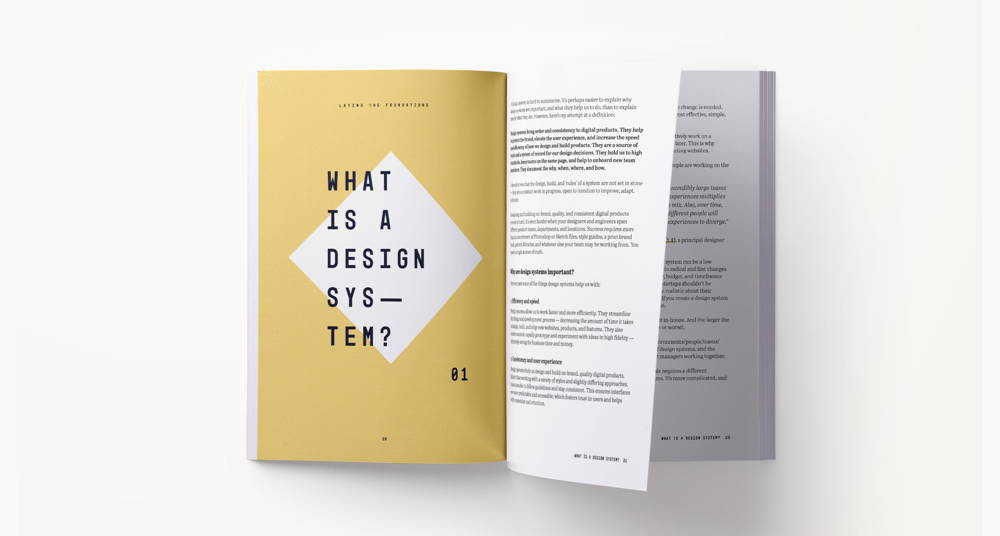 A design systems book spread showing content related to what a design system is